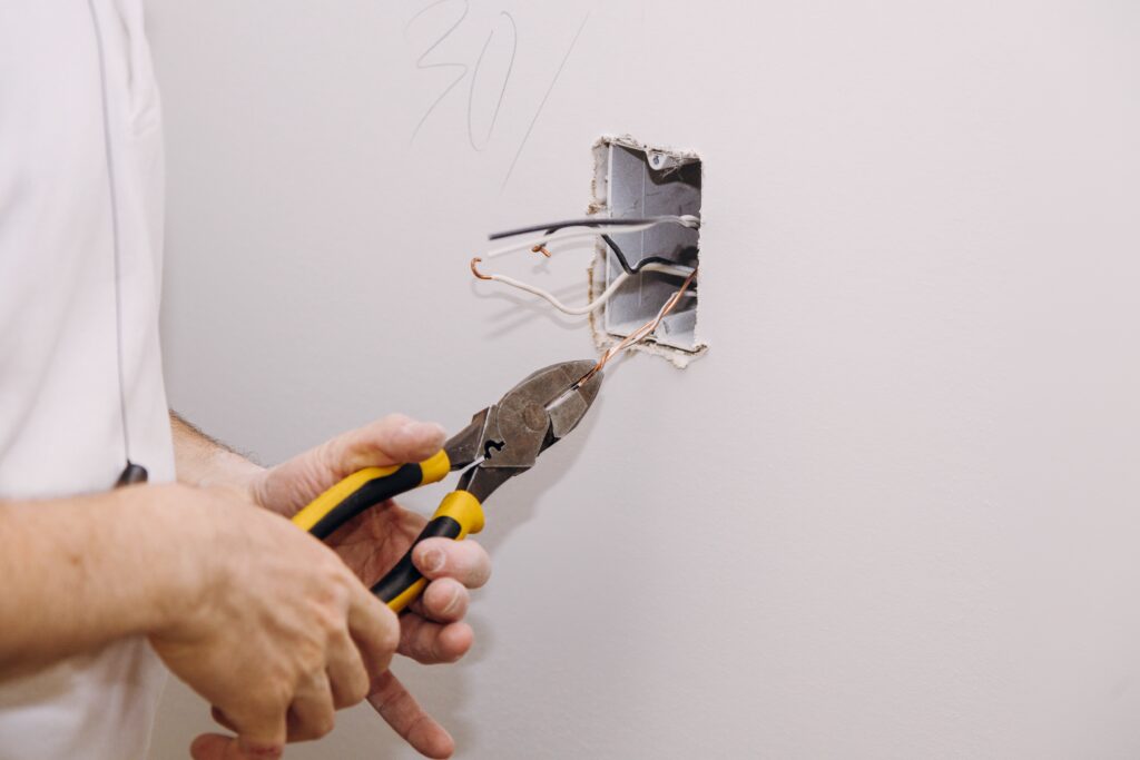 New electrical installation, socket box, switch electrical outlets connector installed in plasterboard drywall for gypsum walls